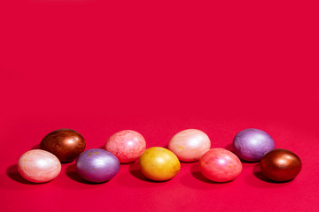 Easter painted eggs isolated on red background