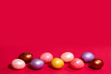 Easter painted eggs isolated on red background