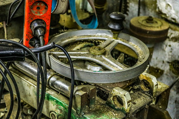 Messy metalsOne part of a garage, interesting metal wheel and couple of different machinery elements.