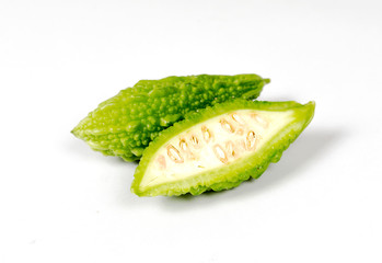 Bitter gourd on a green background.