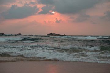 indian ocean at sunset in sri lanka