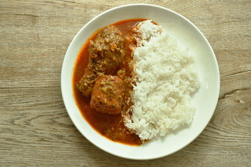 chicken leg spicy and sweet curry or mussaman eat with plain rice on dish