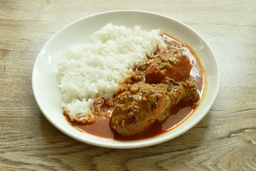 chicken leg spicy and sweet curry or mussaman eat with plain rice on dish