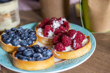 Delicious Tartlets from shortcrust pastry with Blueberries and Raspberries