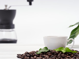 Coffee cup on pile of beans.