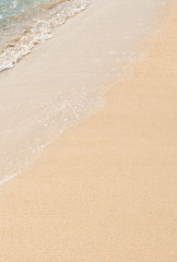 wave of blue ocean on sandy beach. texture Background.