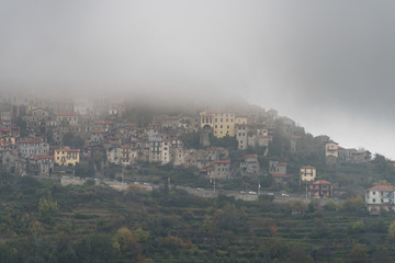 Italy. Triora ancient village covered in dense fog
