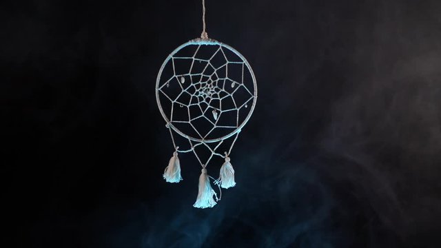 dream catcher on the background of smoke. Mystery and Witchcraft