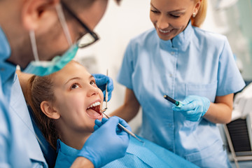 Portrait of female patient having treatment at dentist