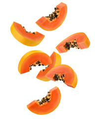Falling papaya slice isolated on white background, clipping path, full depth of field - obrazy, fototapety, plakaty