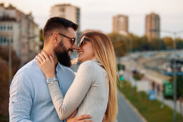 Portrait of attractive young couple in love outdoors