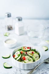 Cucumber spice salad with red onion, red pepper and sesame seeds