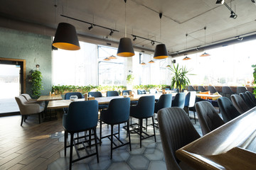 Cozy cafe interior with empty places for eating and resting