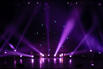 stage light with colored spotlights and smoke, concert scene
