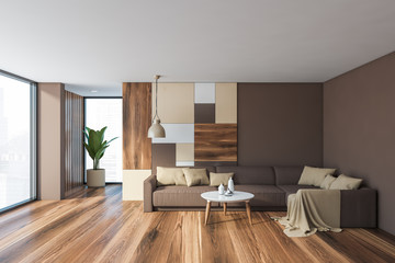 Gray living room interior with brown sofa