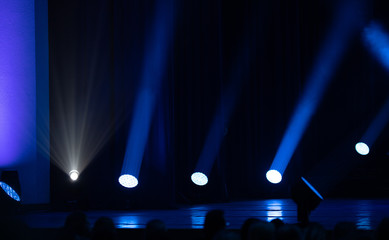 stage light with colored spotlights and smoke, concert scene 