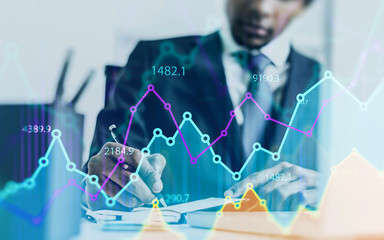 African CEO in office, digital chart