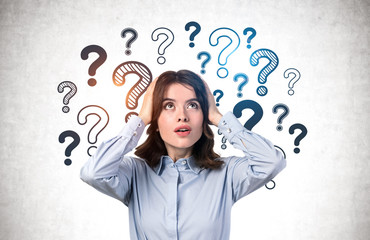 Shocked young woman, question marks