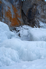 Rock cliff with ice stalactite in Lake Baikal, Russia, landscape photography