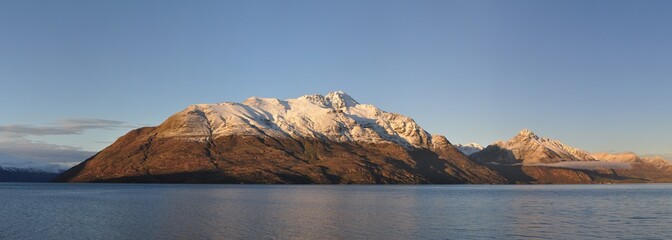 Panorama of Cecil and Walter peaks with snow on, looking out form Queenstown in New Zealand