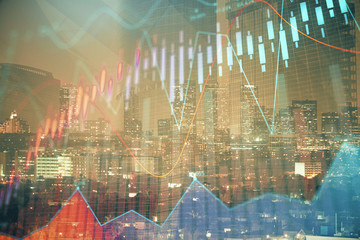 Financial graph on night city scape with tall buildings background multi exposure. Analysis concept.