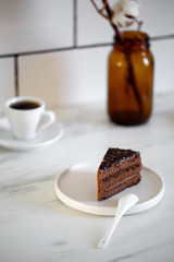 Delicious Chocolate Layer Cake on white marble background
