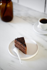 Delicious Chocolate Layer Cake on white marble background