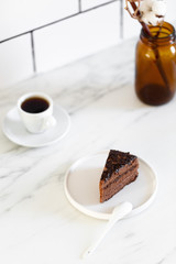 Delicious Chocolate Layer Cake on white marble background