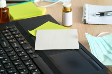 Medicine bottle on an office table with laptop close up