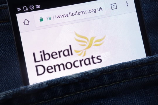 KONSKIE, POLAND - MAY 18, 2018: The Liberal Democrats political party website displayed on smartphone hidden in jeans pocket