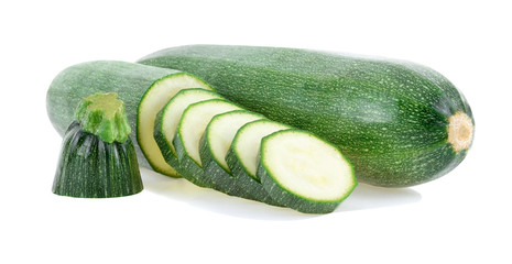 Fresh green zucchini with slice isolated on white background.