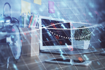 Forex market graph hologram and personal computer on background. Double exposure. Concept of investment.