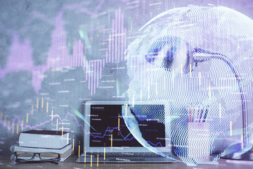 Double exposure of forex graph and work space with computer. Concept of international online trading.