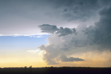 Low precipitation supercell below the anvil of a much larger right moving supercell thunderstorm over the great plains in western Texas