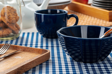 Classic blue empty ceramic tea cup on kitchen table close up