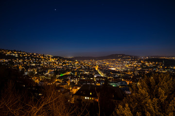 Germany, Famous skyline of stuttgart heslach houses, illuminated by night, aerial view above roofs,...