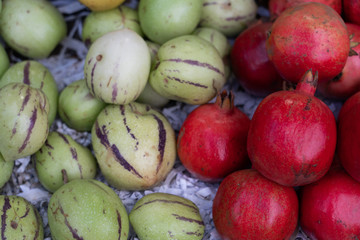 Pomegranate fruits and vegetables on the market