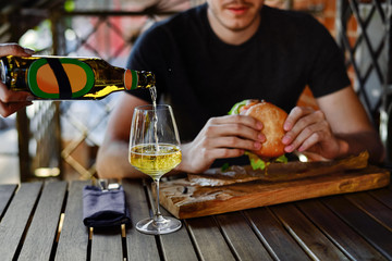 Man is eating in a restaurant and enjoying delicious food