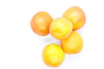 Inculate ripe plums located on a white background