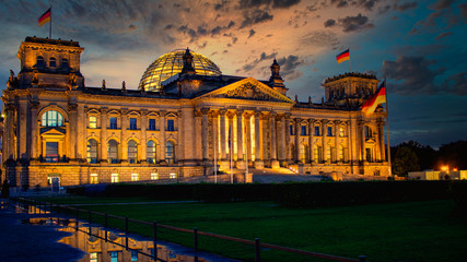 The famous Reichstag building, seat of the German Parliament (Deutscher Bundestag) at sunset in Berlin, Germany - obrazy, fototapety, plakaty