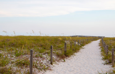 Obraz premium sandy beach path to boardwalk 