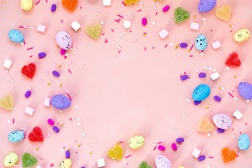 Top view shot of arrangement decoration Happy Easter holiday background concept. Flat lay colorful bunny eggs on beautiful pink desk. Copy space.