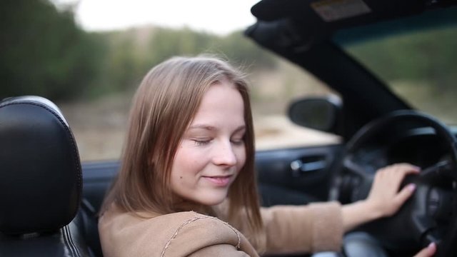 young woman summer cabriolet car driver 