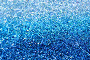 Photo background of bright transparent sea water