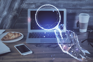 Desktop computer background in office and start up theme hologram drawing. Double exposure. Startup concept.