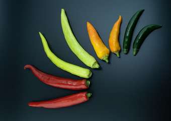 colorful chili on black table