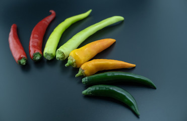 colorful chili on black table