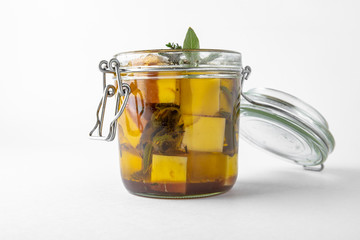 Pickled cheese with herbs, olives. Camembert, brie, mozzarella and dorblu with thyme, sage, rosemary. Gourmet Snack Delicacy. Isolated on White Background