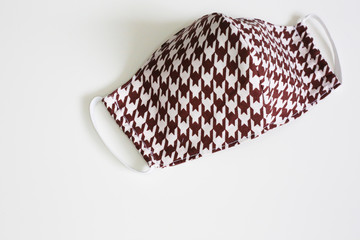 Hand made cotton face mask protective against dust and virus top view. Coronavirus preventive  cotton mask. 