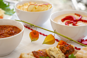 Homemade mashed vegetable paste in bowls and on bread at a local brunch